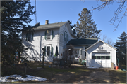 13828 West USH 14, a Gabled Ell house, built in Evansville, Wisconsin in 1880.