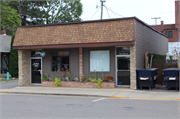121-123 S Main St, a Twentieth Century Commercial small retail building, built in Eagle River, Wisconsin in 1954.