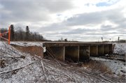 Wozny Road (abandoned) over Totagatic River, a NA (unknown or not a building) dam, built in Frog Creek, Wisconsin in 1953.