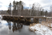 Wozny Road (abandoned) over Totagatic River, a NA (unknown or not a building) dam/lock, built in Frog Creek, Wisconsin in 1953.