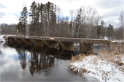 Wozny Road (abandoned) over Totagatic River, a NA (unknown or not a building) dam, built in Frog Creek, Wisconsin in 1953.