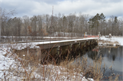 Wozny Road (abandoned) over Totagatic River, a NA (unknown or not a building) dam/lock, built in Frog Creek, Wisconsin in 1953.