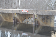 Wozny Road (abandoned) over Totagatic River, a NA (unknown or not a building) dam, built in Frog Creek, Wisconsin in 1953.