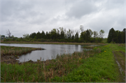 East end of Mud Lake, 0.75 mile west of Hagan Rd., a NA (unknown or not a building) dam/lock, built in Lowville, Wisconsin in 1948.