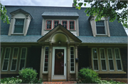 216 WATERTOWN ST, a Dutch Colonial Revival house, built in Ripon, Wisconsin in 1921.