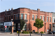 913-925 MAIN ST, a Romanesque Revival large retail building, built in Stevens Point, Wisconsin in 1885.