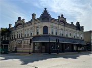 225-227 E MILL ST, a German Renaissance Revival large retail building, built in Plymouth, Wisconsin in 1889.