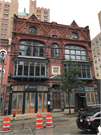 725-729 N MILWAUKEE ST, a Queen Anne large retail building, built in Milwaukee, Wisconsin in 1881.