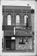 107 W OAK ST, a Commercial Vernacular small retail building, built in Sparta, Wisconsin in 1869.