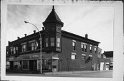125-127 W OAK ST, a Queen Anne large retail building, built in Sparta, Wisconsin in 1896.