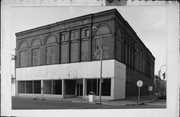 100 S WATER ST, a Romanesque Revival large retail building, built in Sparta, Wisconsin in 1870.