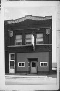 213 S WATER ST, a Commercial Vernacular small retail building, built in Sparta, Wisconsin in 1912.