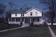 1345 MAIN ST, a Greek Revival house, built in Oconto, Wisconsin in 1851.