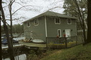 7220 NEWELL RD, a Craftsman boat house, built in Hazelhurst, Wisconsin in 1939.