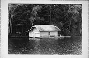 9512 COUNTRY CLUB RD ON LAKE MINOCQUA, a Queen Anne boat house, built in Minocqua, Wisconsin in 1913.