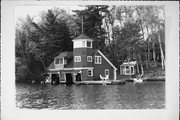 9512 COUNTRY CLUB RD ON LAKE MINOCQUA, a Queen Anne boat house, built in Minocqua, Wisconsin in 1913.