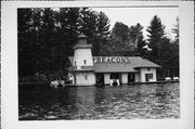 LAKE MINOCQUA, a Craftsman boat house, built in Minocqua, Wisconsin in 1908.