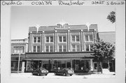 25-35 S BROWN ST, a Prairie School large retail building, built in Rhinelander, Wisconsin in 1915.