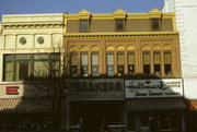106, 108, 110 W COLLEGE AVE, a Italianate small retail building, built in Appleton, Wisconsin in 1880.
