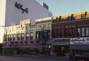 106, 108, 110 W COLLEGE AVE, a Italianate small retail building, built in Appleton, Wisconsin in 1880.