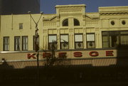 106, 108, 110 W COLLEGE AVE, a Italianate small retail building, built in Appleton, Wisconsin in 1880.