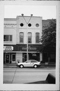 121 E COLLEGE AVE, a Commercial Vernacular small retail building, built in Appleton, Wisconsin in 1870.