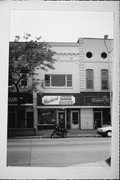 123,123 1/2 E COLLEGE AVE, a Commercial Vernacular small retail building, built in Appleton, Wisconsin in 1890.