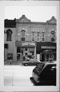 203 W COLLEGE AVE, a Early Gothic Revival retail building, built in Appleton, Wisconsin in 1880.