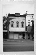 518 W COLLEGE AVE, a Queen Anne small retail building, built in Appleton, Wisconsin in 1894.