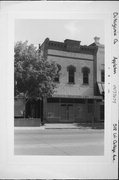 518 W COLLEGE AVE, a Queen Anne small retail building, built in Appleton, Wisconsin in 1894.