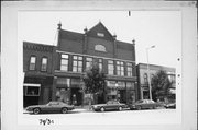 137-139-141 E 2ND ST, a Romanesque Revival retail building, built in Kaukauna, Wisconsin in 1895.