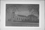 N4106 County Highway DD, a Romanesque Revival house of worship, built in Ellsworth, Wisconsin in 1885.