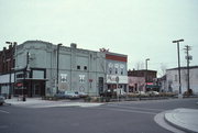 913-925 MAIN ST, a Romanesque Revival retail building, built in Stevens Point, Wisconsin in 1885.