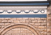 1136 MAIN ST, a Romanesque Revival retail building, built in Stevens Point, Wisconsin in 1900.