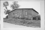 7229 CUSTER RD, a Astylistic Utilitarian Building warehouse, built in Stockton, Wisconsin in 1875.