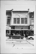 1136 MAIN ST, a Romanesque Revival small retail building, built in Stevens Point, Wisconsin in 1900.
