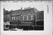 1136 MAIN ST, a Romanesque Revival retail building, built in Stevens Point, Wisconsin in 1900.