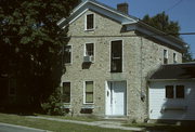 208-210 W JEFFERSON ST, a Greek Revival house, built in Burlington, Wisconsin in 1851.