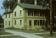 172-176 W STATE ST, a Greek Revival duplex, built in Burlington, Wisconsin in 1844.