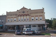 104 JANESVILLE ST, a Romanesque Revival retail building, built in Oregon, Wisconsin in 1898.