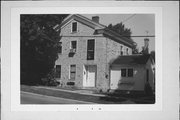 208-210 W JEFFERSON ST, a Greek Revival house, built in Burlington, Wisconsin in 1851.