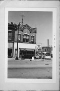 216 S MAIN ST, a Commercial Vernacular small retail building, built in Racine, Wisconsin in 1882.
