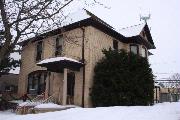 110 E PULASKI ST, a Queen Anne house, built in Pulaski, Wisconsin in 1895.