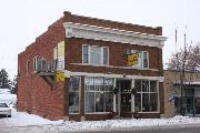 144 W PULASKI ST 144 W PULASKI ST, a Commercial Vernacular small retail building, built in Pulaski, Wisconsin in 1920.