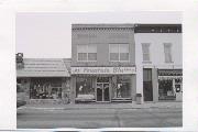 113 E Wall St, a Commercial Vernacular small retail building, built in Eagle River, Wisconsin in 1922.