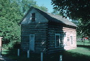 Antigo Public Library and Deleglise Cabin, a Building.