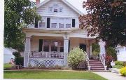 114 JEFFERSON AVE, a Queen Anne house, built in Janesville, Wisconsin in 1908.