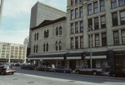 131-137 E WELLS ST, a Italianate retail building, built in Milwaukee, Wisconsin in 1870.