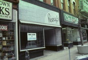 719-723 N MILWAUKEE ST, a Italianate retail building, built in Milwaukee, Wisconsin in 1874.