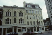 700-02 N MILWAUKEE ST, a Second Empire large retail building, built in Milwaukee, Wisconsin in 1866.
